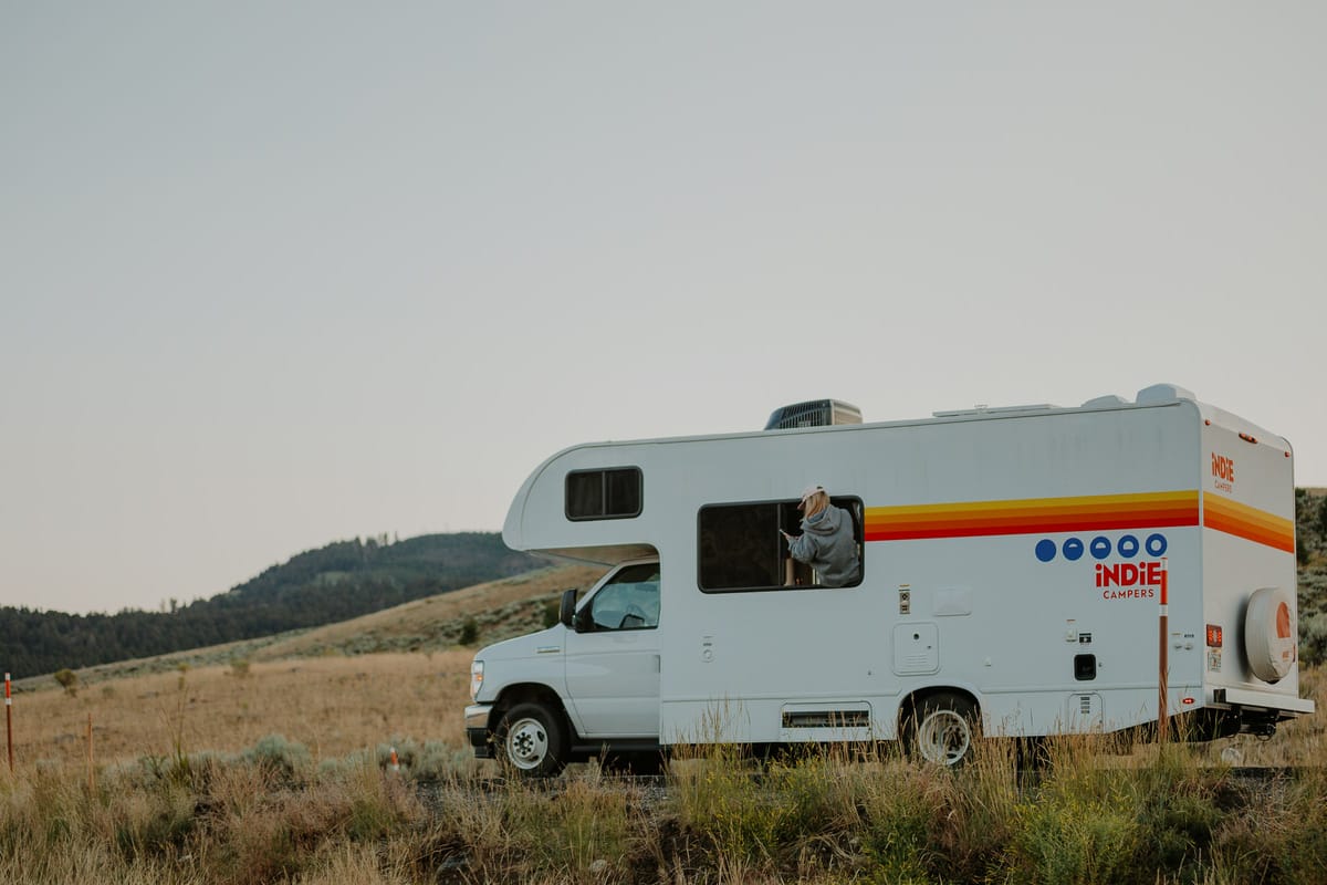 Indie Campers motorhome parked in open grassland